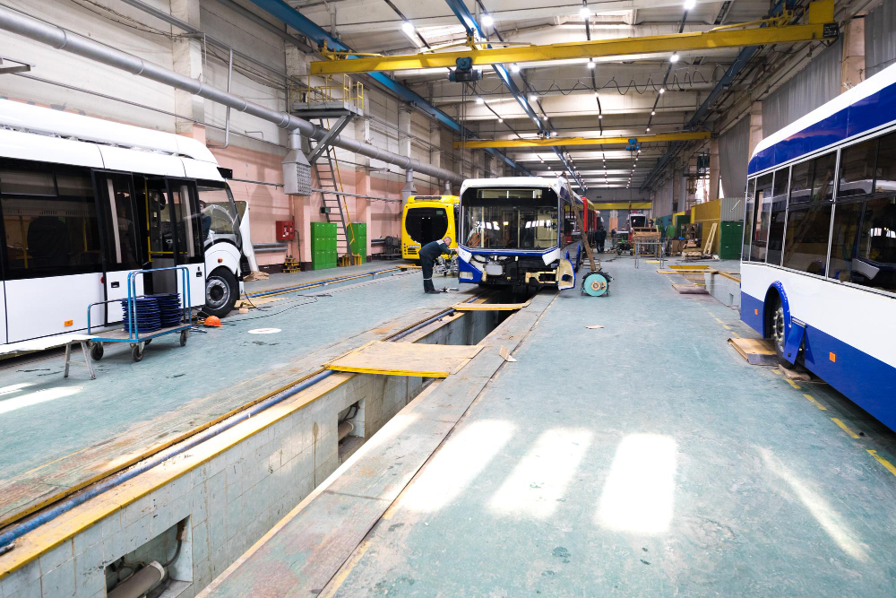 one-working-day-modern-automatic-bus-manufacturing-with-unfinished-cars-workers-protective-uniform (1).jpg
